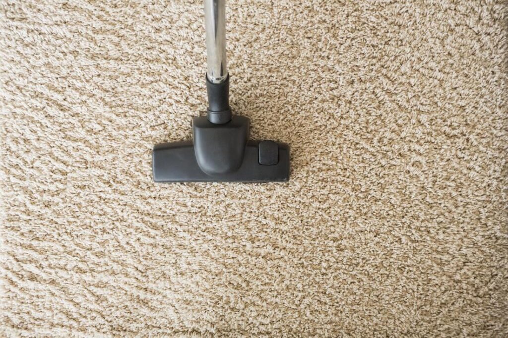 cleaning carpet using vacuum