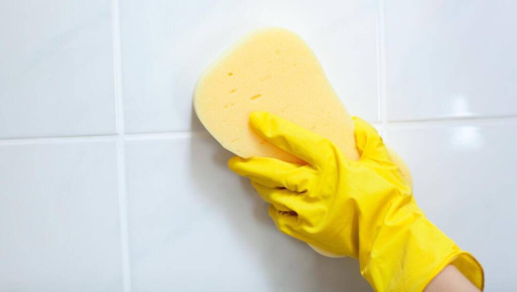 girl cleaning grout tile
