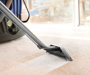 vacuuming a dirty carpet